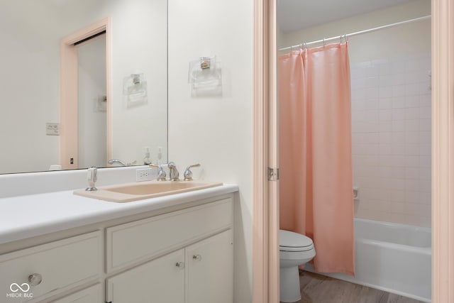 3905 Cove Rd, Columbus, IN 47203 - full bath featuring vanity, shower / bath combo, and wood finished floors