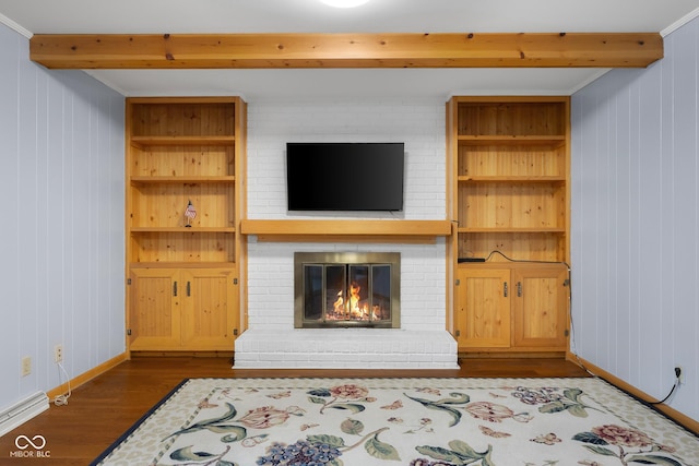 3905 Cove Rd, Columbus, IN 47203 - unfurnished living room featuring beam ceiling, a fireplace, dark wood-style floors, and wooden walls