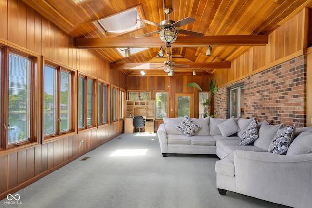 3905 Cove Rd, Columbus, IN 47203 - carpeted living room featuring wooden walls, ceiling fan, wooden ceiling, and a skylight