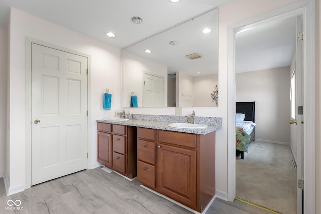 3905 Cove Rd, Columbus, IN 47203 - ensuite bathroom with double vanity and recessed lighting