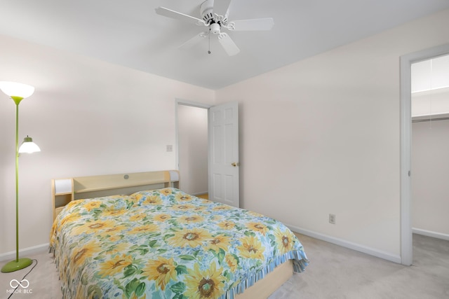 3905 Cove Rd, Columbus, IN 47203 - bedroom featuring light colored carpet, a walk in closet, and a ceiling fan