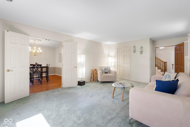 3905 Cove Rd, Columbus, IN 47203 - living area with carpet, a chandelier, and stairway