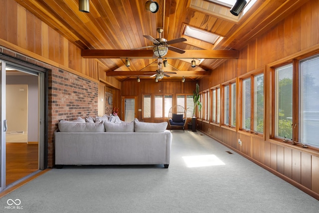 3905 Cove Rd, Columbus, IN 47203 - sunroom with wooden ceiling, wooden walls, a skylight, and carpet