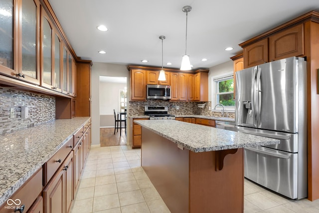 3905 Cove Rd, Columbus, IN 47203 - kitchen featuring appliances with stainless steel finishes, recessed lighting, light tile patterned floors, and backsplash
