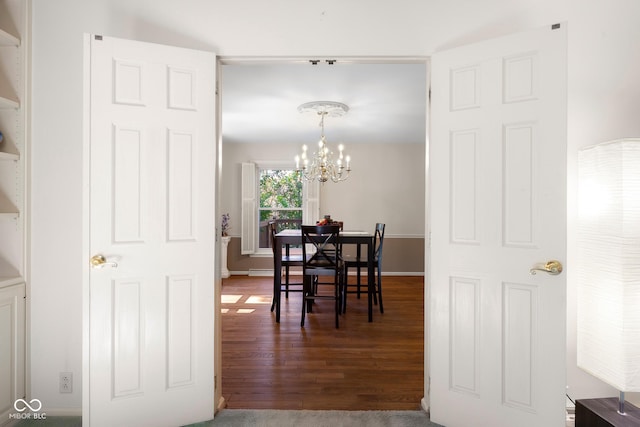 3905 Cove Rd, Columbus, IN 47203 - dining space with a chandelier and wood finished floors