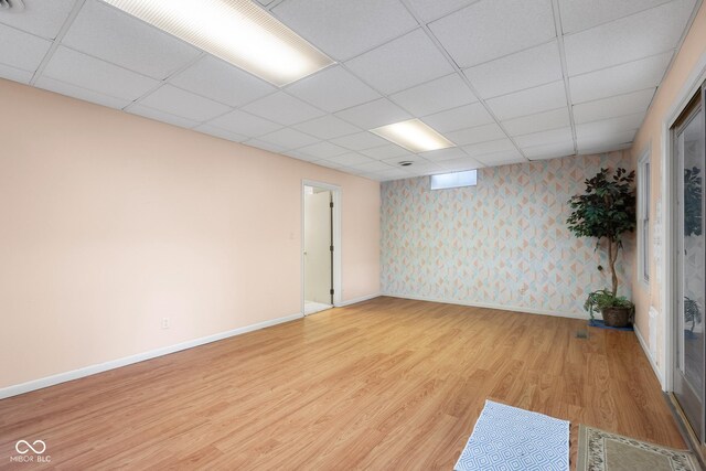3905 Cove Rd, Columbus, IN 47203 - empty room featuring wallpapered walls, light wood-style floors, and a drop ceiling