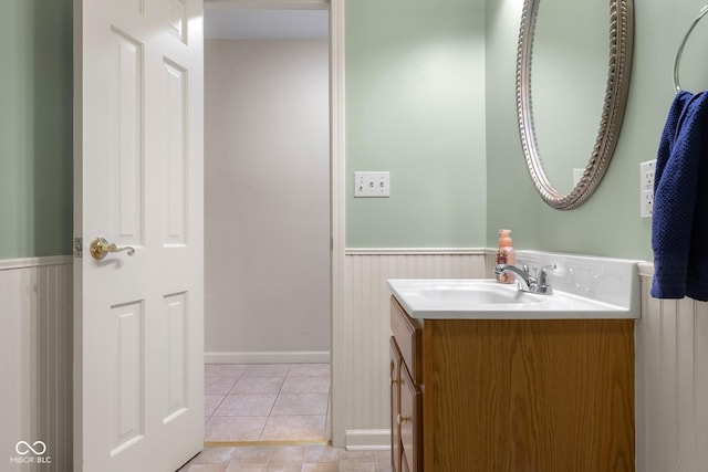 3905 Cove Rd, Columbus, IN 47203 - bathroom with a wainscoted wall, vanity, and tile patterned floors