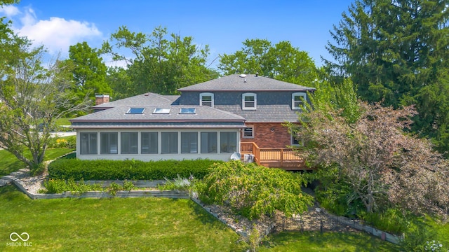 3905 Cove Rd, Columbus, IN 47203 - back of house featuring a sunroom, a deck, and a lawn