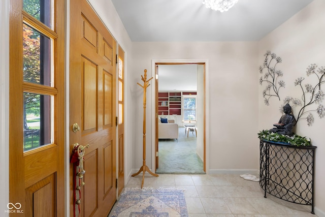 3905 Cove Rd, Columbus, IN 47203 - entryway with light carpet and light tile patterned floors