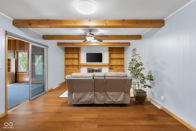 3905 Cove Rd, Columbus, IN 47203 - living area featuring wood finished floors, beamed ceiling, ceiling fan, wood walls, and crown molding