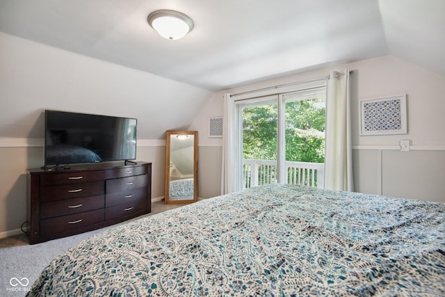 897 Wildwood Rd, North Vernon, IN 47265 - carpeted bedroom with lofted ceiling and access to outside