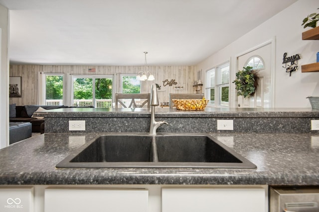 897 Wildwood Rd, North Vernon, IN 47265 - kitchen featuring a chandelier, healthy amount of natural light, dark stone countertops, and open floor plan
