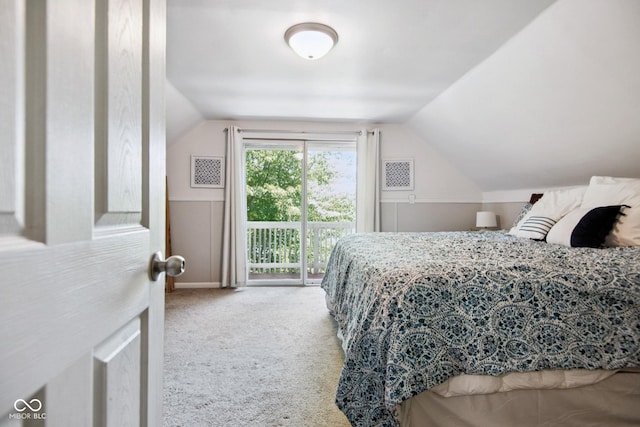 897 Wildwood Rd, North Vernon, IN 47265 - carpeted bedroom with access to outside and vaulted ceiling