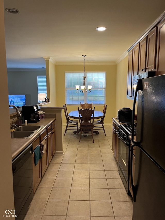 3547 Heathcliff Ct, Westfield, IN 46074 - kitchen featuring black appliances, crown molding, light tile patterned floors, a chandelier, and hanging light fixtures