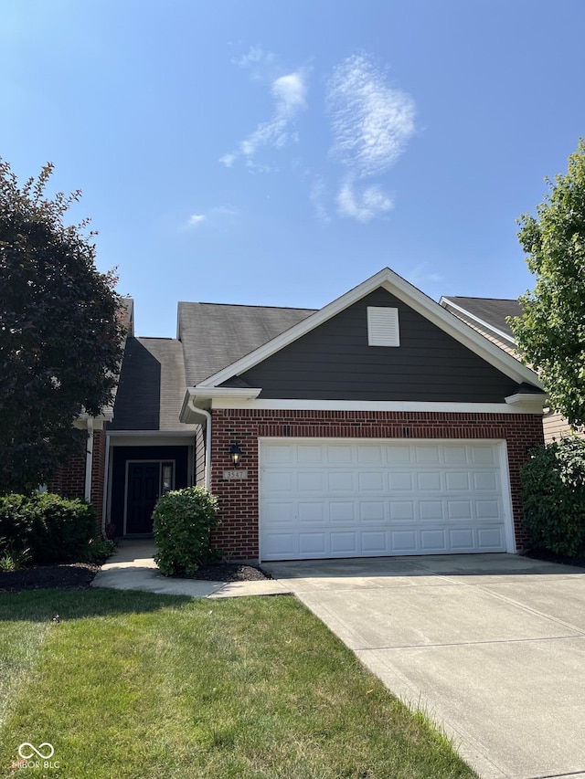 3547 Heathcliff Ct, Westfield, IN 46074 - view of front of house with brick siding, an attached garage, driveway, and a front lawn