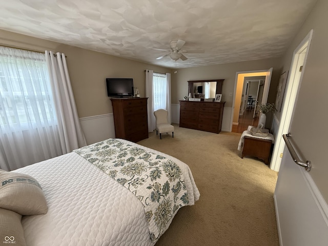 56 E Colony Acres Dr, Brazil, IN 47834 - bedroom with light colored carpet and a ceiling fan