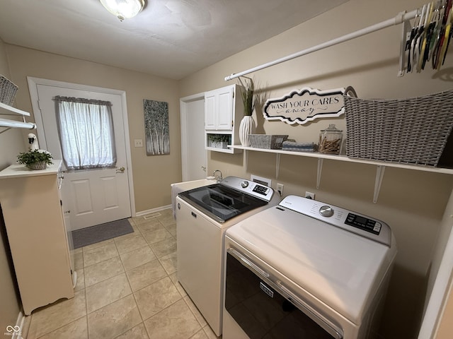 56 E Colony Acres Dr, Brazil, IN 47834 - washroom featuring independent washer and dryer, cabinet space, and light tile patterned floors