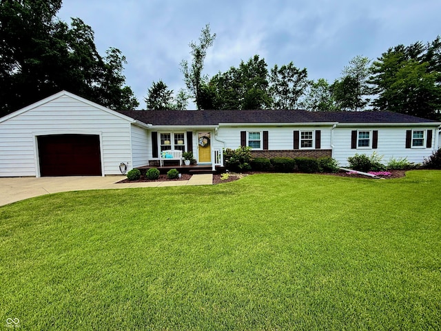 56 E Colony Acres Dr, Brazil, IN 47834 - ranch-style home featuring a front lawn, concrete driveway, covered porch, and a garage