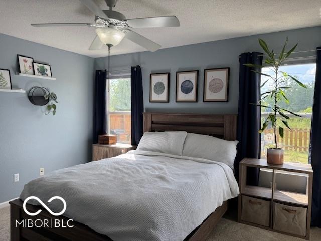 5714 High Timber Ln, Indianapolis, IN 46235 - carpeted bedroom with a ceiling fan