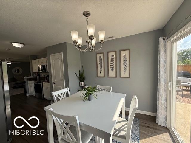 5714 High Timber Ln, Indianapolis, IN 46235 - dining room with wood finished floors and a chandelier