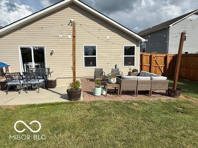 5714 High Timber Ln, Indianapolis, IN 46235 - rear view of house with an outdoor hangout area and a patio area