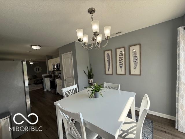 5714 High Timber Ln, Indianapolis, IN 46235 - dining space featuring dark wood-style flooring and a chandelier
