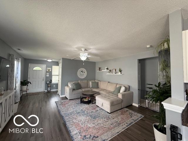 5714 High Timber Ln, Indianapolis, IN 46235 - living area with ceiling fan, a textured ceiling, and wood finished floors
