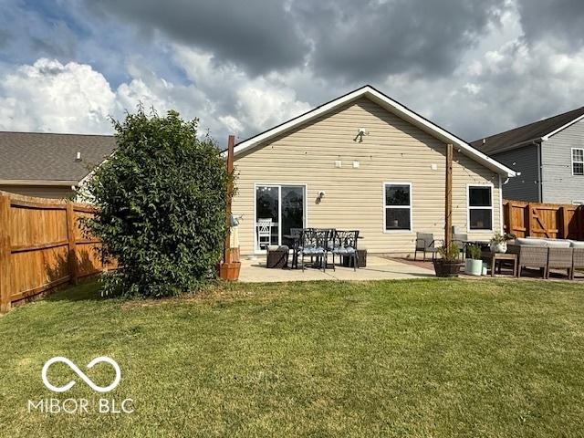5714 High Timber Ln, Indianapolis, IN 46235 - rear view of property featuring a fenced backyard, outdoor lounge area, and a patio