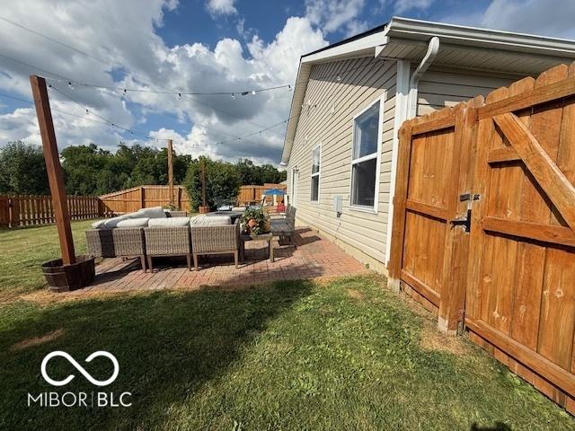 5714 High Timber Ln, Indianapolis, IN 46235 - fenced backyard with an outdoor hangout area and a patio area