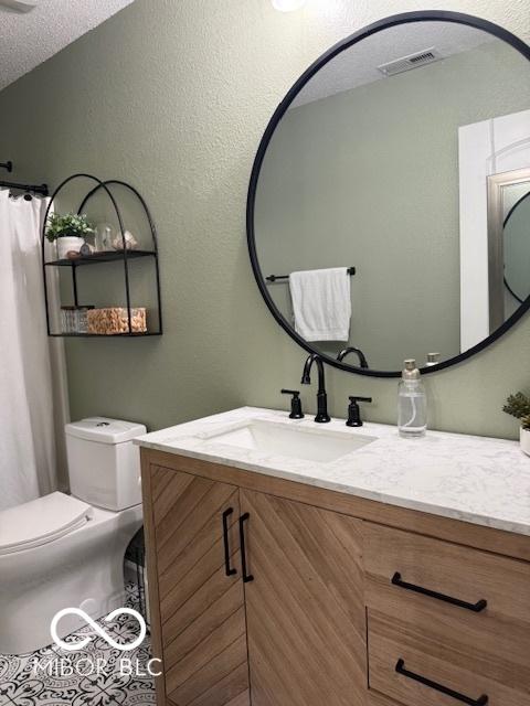 5714 High Timber Ln, Indianapolis, IN 46235 - bathroom featuring vanity and a textured ceiling