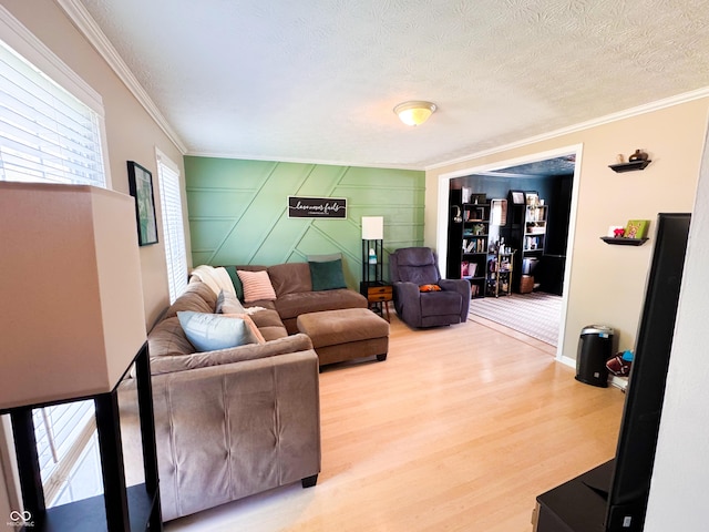 8017 Cardinal Cv W, Indianapolis, IN 46256 - living room with crown molding, plenty of natural light, wood finished floors, and a textured ceiling