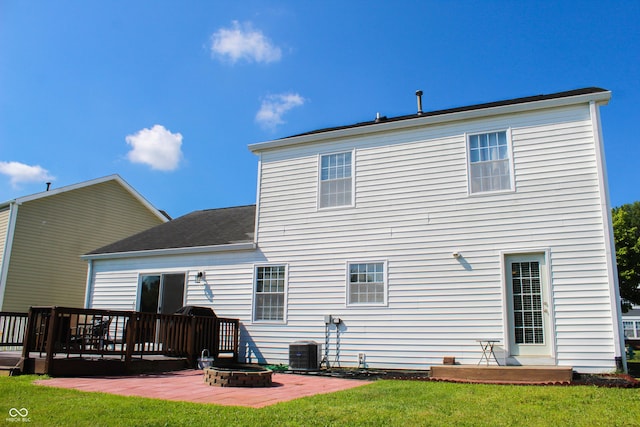 8017 Cardinal Cv W, Indianapolis, IN 46256 - rear view of house with a patio area, a wooden deck, a yard, and a fire pit