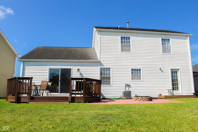 8017 Cardinal Cv W, Indianapolis, IN 46256 - back of house featuring a deck, a lawn, a patio, and roof with shingles
