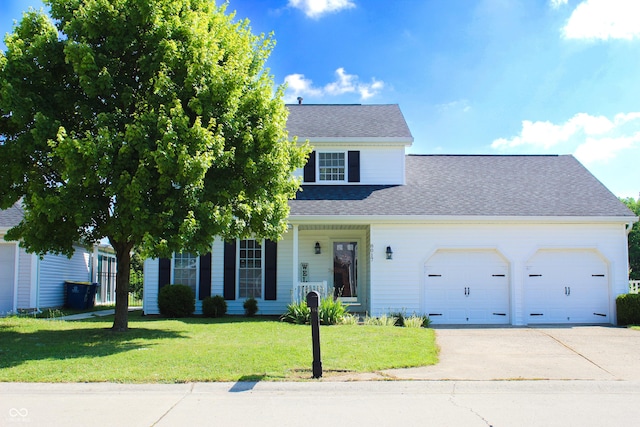 8017 Cardinal Cv W, Indianapolis, IN 46256 - view of front of home with an attached garage, driveway, a front lawn, a shingled roof, and a porch