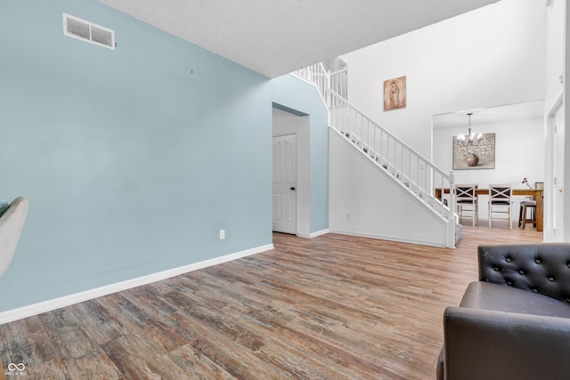 10249 Winlee Ct, Indianapolis, IN 46236 - living area featuring a chandelier, stairs, and wood finished floors