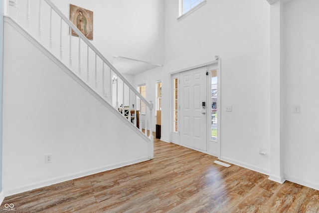 10249 Winlee Ct, Indianapolis, IN 46236 - foyer with stairs, wood finished floors, and a towering ceiling