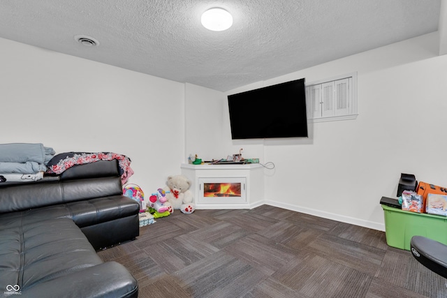 10249 Winlee Ct, Indianapolis, IN 46236 - playroom with a textured ceiling, a warm lit fireplace, and carpet floors