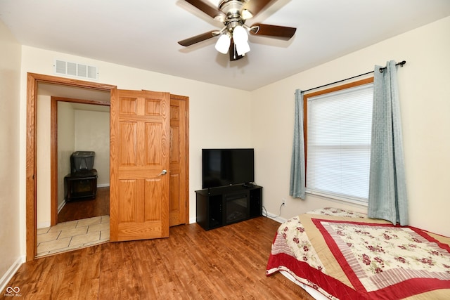 4020 S Lynhurst Dr, Indianapolis, IN 46221 - bedroom with wood finished floors and a ceiling fan
