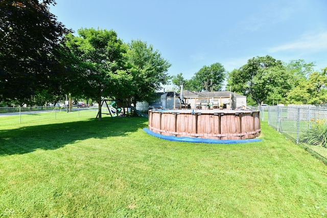 4020 S Lynhurst Dr, Indianapolis, IN 46221 - fenced backyard featuring a playground