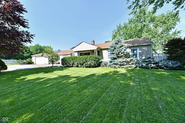 4020 S Lynhurst Dr, Indianapolis, IN 46221 - ranch-style home featuring a garage, an outbuilding, and a chimney