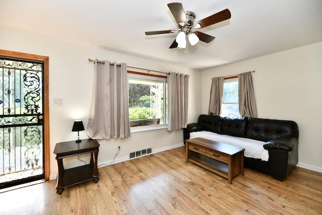 4020 S Lynhurst Dr, Indianapolis, IN 46221 - living area featuring a ceiling fan and light wood-style flooring