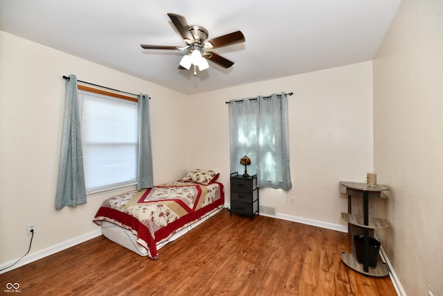 4020 S Lynhurst Dr, Indianapolis, IN 46221 - bedroom featuring wood finished floors and a ceiling fan