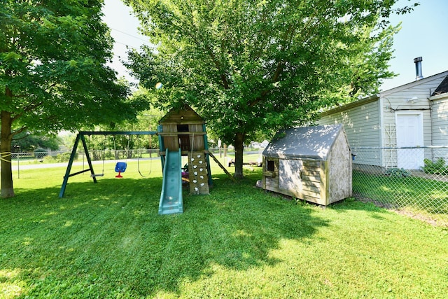 4020 S Lynhurst Dr, Indianapolis, IN 46221 - view of yard with a playground and a storage unit