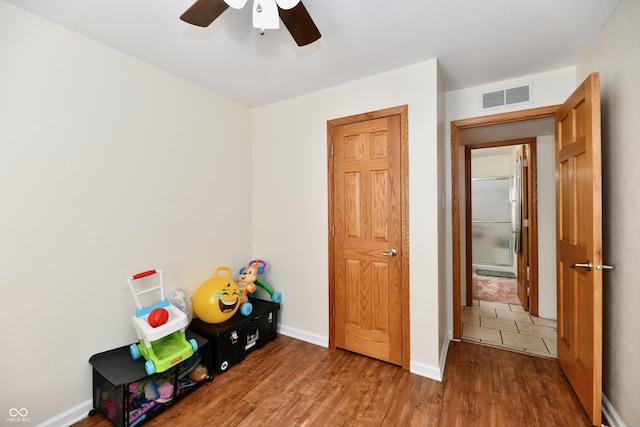 4020 S Lynhurst Dr, Indianapolis, IN 46221 - game room with ceiling fan and wood finished floors