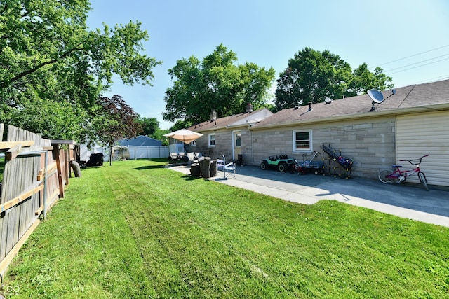 4020 S Lynhurst Dr, Indianapolis, IN 46221 - fenced backyard featuring a patio