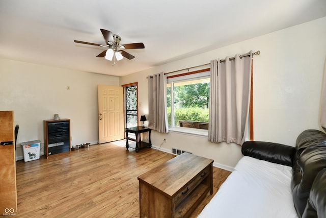 4020 S Lynhurst Dr, Indianapolis, IN 46221 - living room with ceiling fan and light wood-type flooring