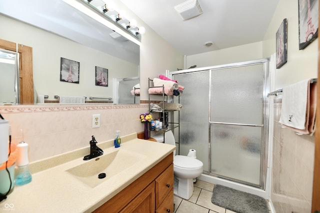 4020 S Lynhurst Dr, Indianapolis, IN 46221 - full bath featuring a shower stall, vanity, tile walls, tile patterned floors, and backsplash