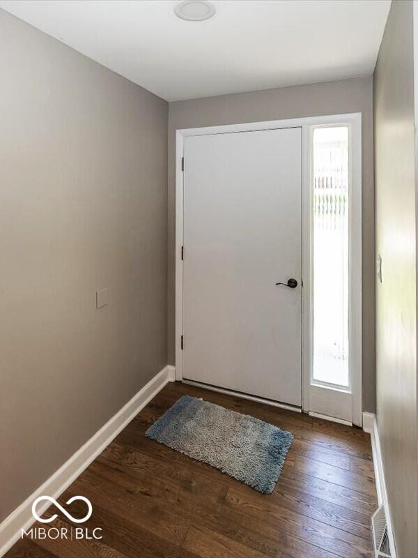 3040 Revere Ct, Columbus, IN 47203 - foyer featuring plenty of natural light and wood finished floors