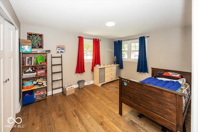 3040 Revere Ct, Columbus, IN 47203 - bedroom with wood finished floors and baseboards