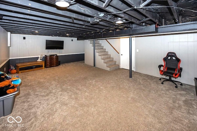 3040 Revere Ct, Columbus, IN 47203 - finished below grade area featuring stairs, carpet floors, and wooden walls